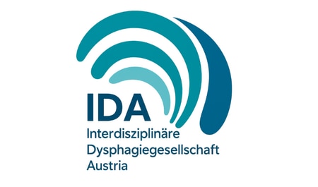 Logo der „IDA – Interdisziplinäre Dysphagiegesellschaft Austria“ mit türkis-blauen Bögen und Schriftzug auf hellem Hintergrund.